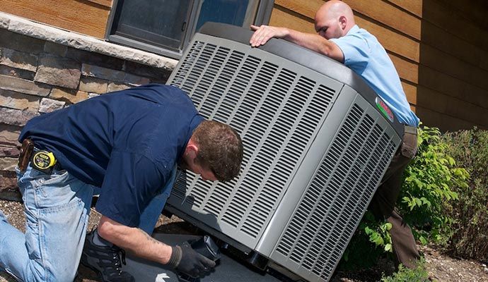 Professional team replacing air conditioner