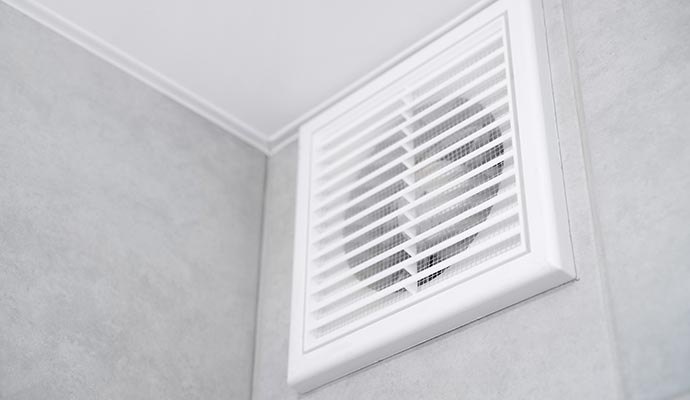 a white ventilator install in a house wall