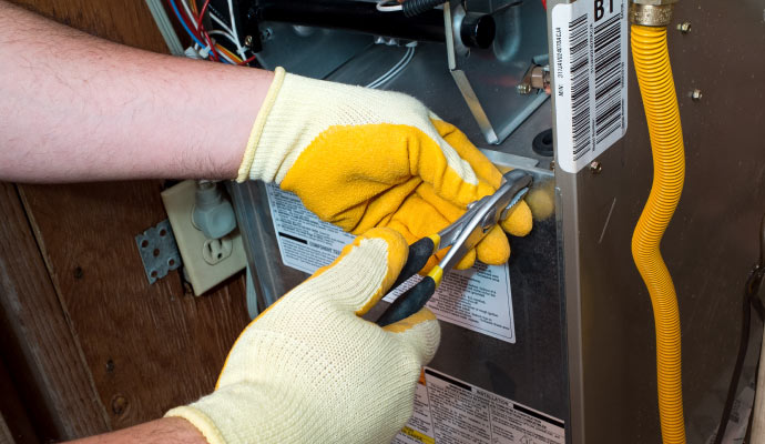 professional worker replacing heater unit