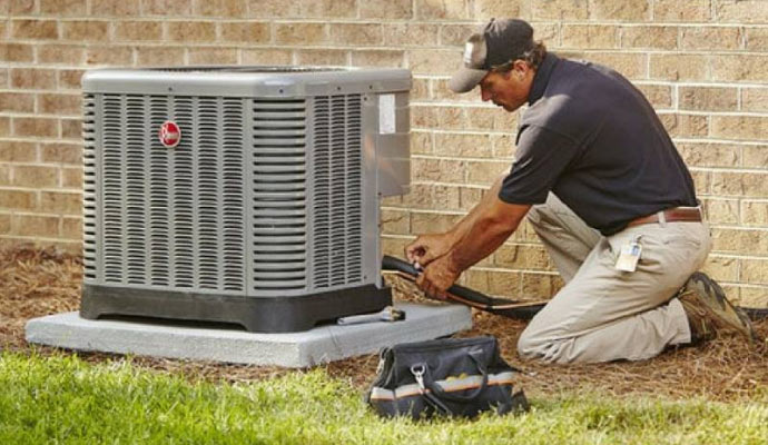 Person repairing a HVAC system